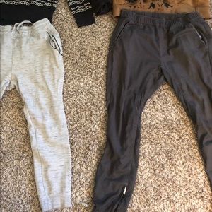 Dark grey joggers with zipper on the ankles